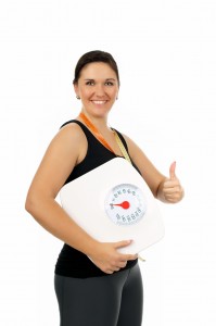 young woman with a weight scale